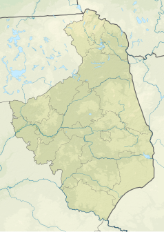 Mapa konturowa województwa podlaskiego, u góry nieco na prawo znajduje się owalna plamka nieco zaostrzona i wystająca na lewo w swoim dolnym rogu z opisem „Sajenek”