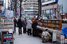 Sidewalk book shelves at a store in Jimbōchō Book Town