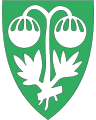 1563 Sunndal I grønt en sølv malurt [142], en plante utbredt i kommunen.