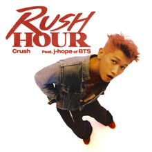 Overhead shot of Crush in a denim jacket standing and looking up into the camera, surrounded by a white background. "Rush Hour" is written in red uppercase text to the top left side of the photo, with "Crush Feat. j-hope of BTS" underneath it in smaller print.
