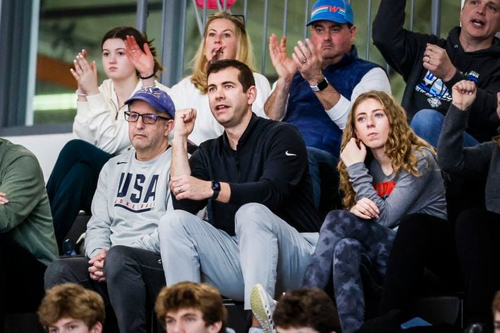 When in the stands for Wellesley High games, basketball savant Brad Stevens (center) left the coaching to others. On this night, he's joined by former Knicks coach Jeff Van Gundy (left), a consultant for the Celtics, and his daughter Kinsley (right).