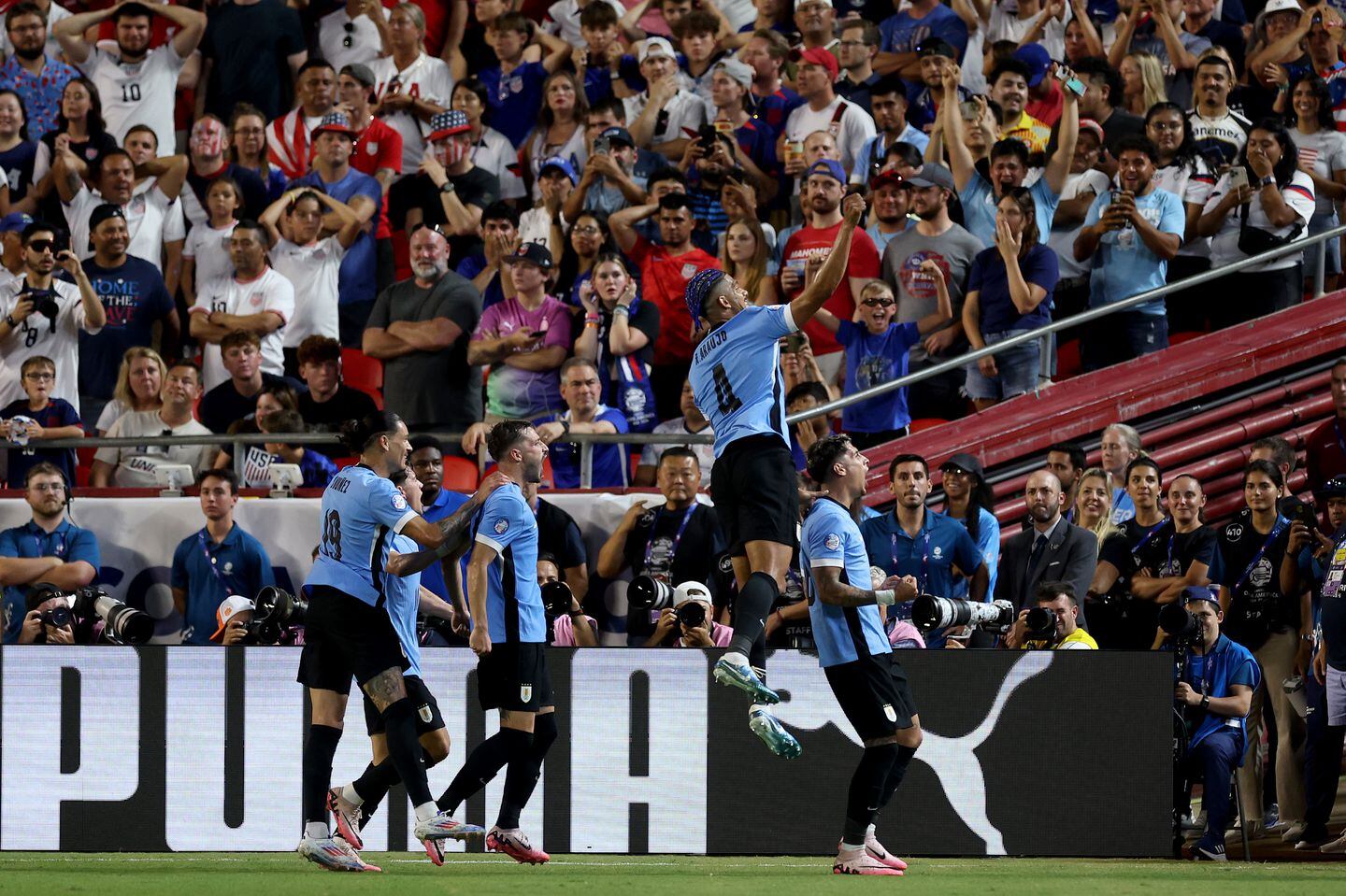 Mathias Olivera of Uruguay took to the sky after scoring the team's goal.