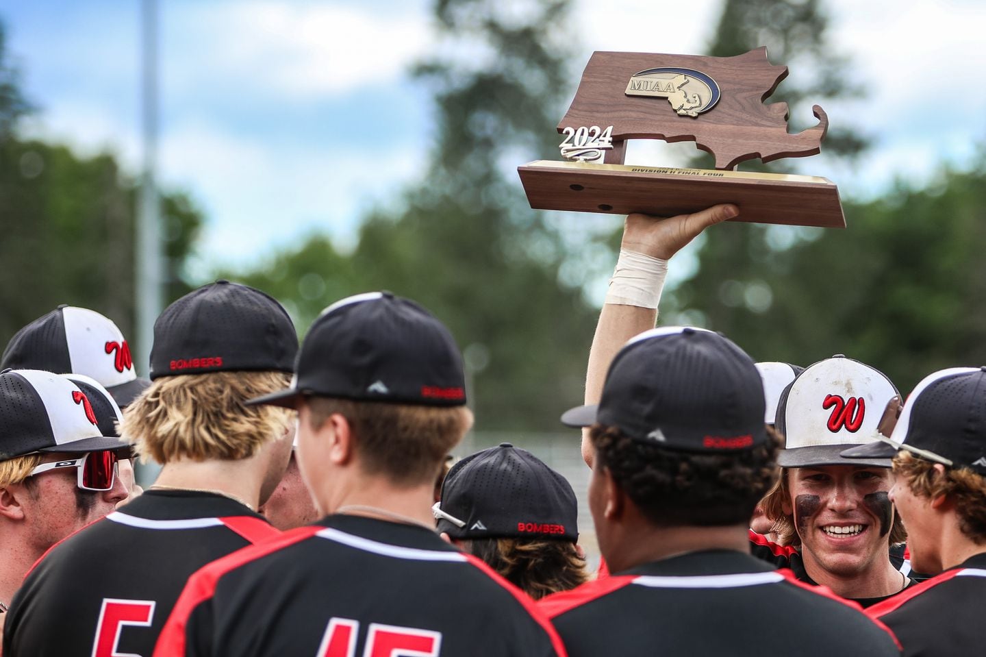 The Westfield High School baseball team celebrates with the Final Four trophy after beating visiting Hopkinton, 7-2, in the MIAA Division 2 quarterfinals on June 10, 2024