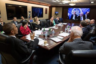 U.S. President Barack Obama receives an update in the Situation Room at the White House in Washington from Secretary of State Jo