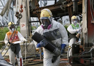 Workers conduct operations to construct an underground ice wall at Tepco's tsunami-crippled Fukushima Daiichi nuclear power plan