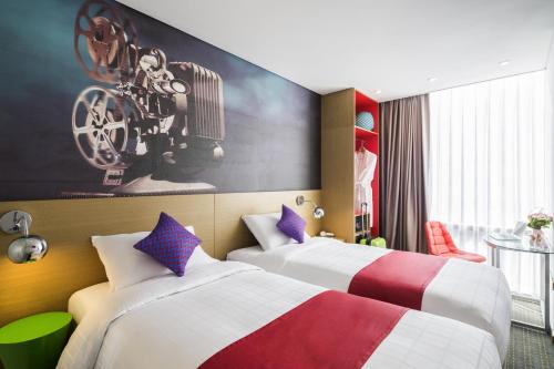 Postel nebo postele na pokoji v ubytování ibis Styles Ambassador Seoul Myeong-dong