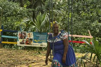 Saray Zuñiga sits on a swing at the eco-park built thanks the FAO-Sweden project. 