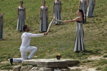 a man and woman holding a sword