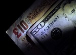 Dollar slips ahead of payrolls; sterling gains post election