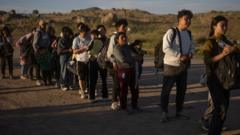 Asylum-seeking migrants from China and Ecuador surrender to officials after crossing the border into the United States from Mexico in Jacumba Hot Springs, California, U.S., May 13, 2024.