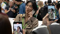 An attendee makes a video with the new iPhone 16 Pro as Apple holds an event at the Steve Jobs Theater on its campus in Cupertino, California, U.S. September 9, 2024