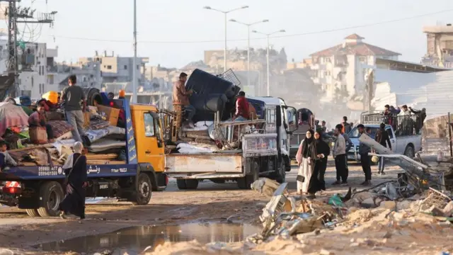 Displaced Palestinians who fled Rafah, ahead of a threatened Israeli assault, travel in Khan Younis