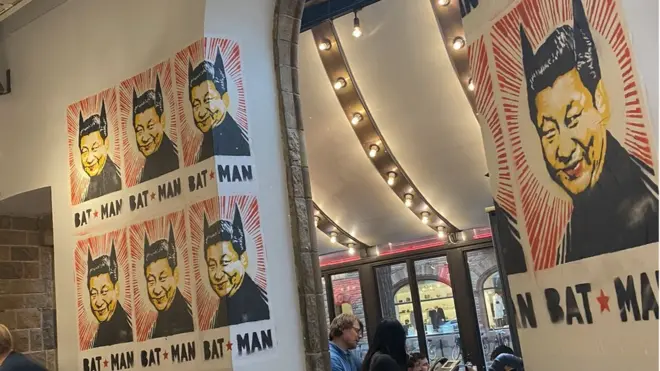 Posters showing Chinese leader Xi Jinping wearing bat ears