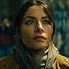 Sarah Shahi and Bodhi Sabongui in Black Adam (2022)