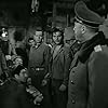 William Holden, Neville Brand, Richard Erdman, Peter Graves, Jay Lawrence, Harvey Lembeck, Otto Preminger, and Robert Strauss in Stalag 17 (1953)