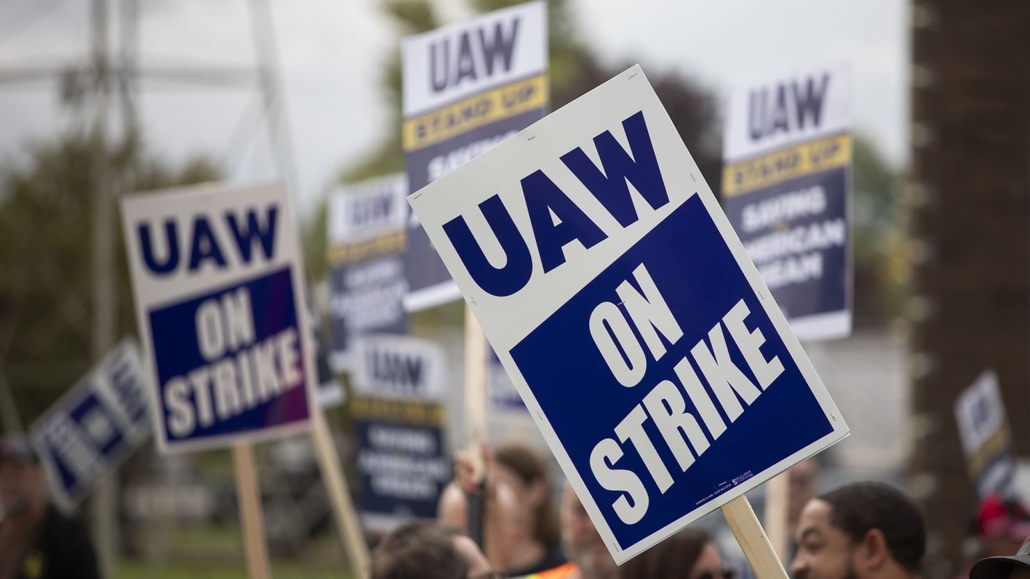 United Auto Workers union members strike at a General Motors plant in Lansing, Michigan, on September 29, 2023.