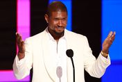 US singer-songwriter Usher speaks on stage after accepting the Lifetime Achievment award during the 2024 BET Awards at the Peacock theatre in Los Angeles, June 30, 2024.