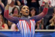 Simone Biles reacts after finishing her routine in the floor exercise on Day Four of the 2024 U.S. Olympic Team Gymnastics Trials at Target Center on June 30, 2024