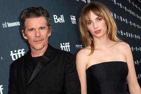 Ethan Hawke (L) and his daughter US actress Maya Hawke arrive for the premiere of "Wildcat" during the Toronto International Film Festival (TIFF) at the Royal Alexandra Theatre in Toronto, Ontario, Canada, on September 11, 2023