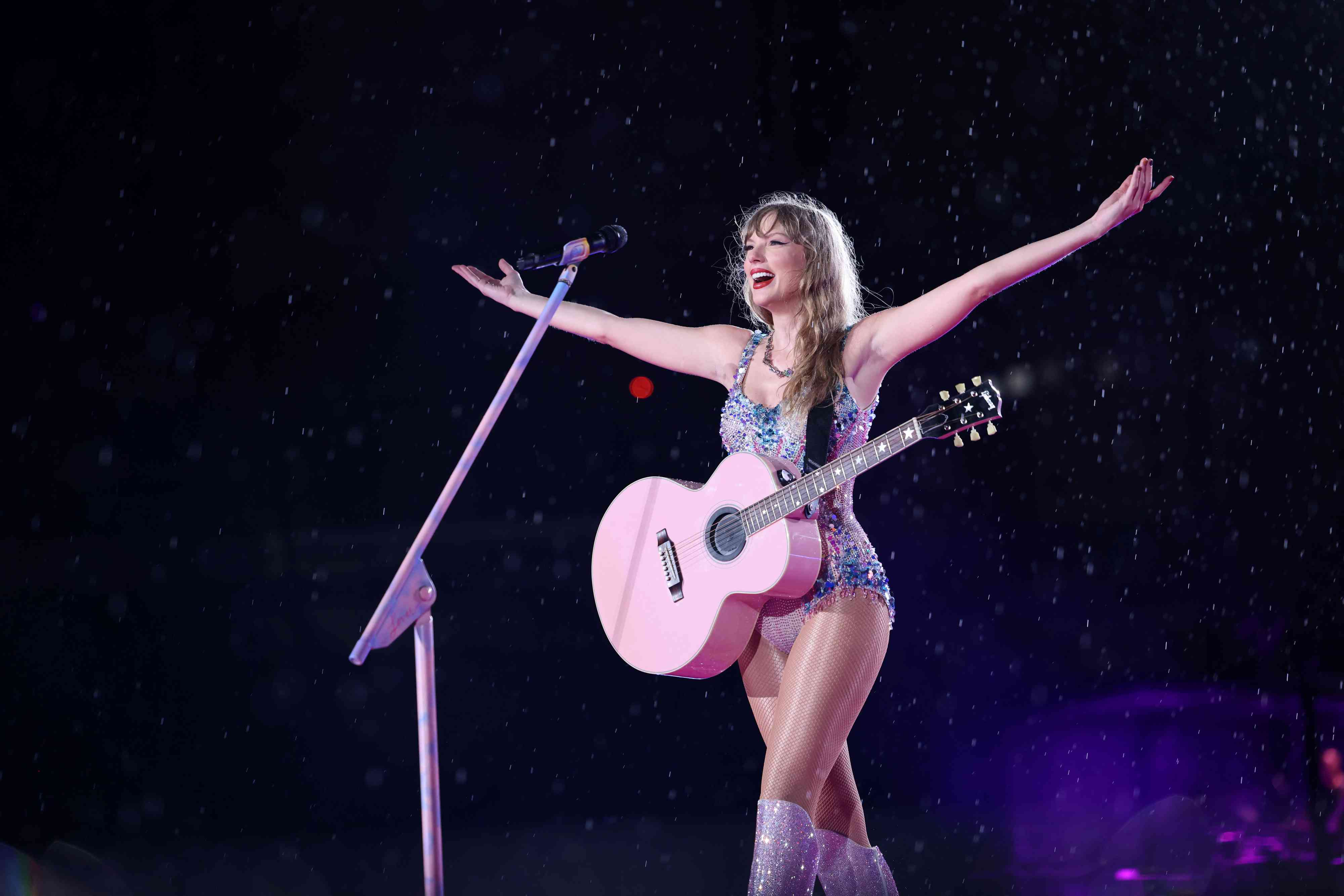 Taylor Swift Performing In Crystal Bodysuit and Guitar Hands Up to the Side 