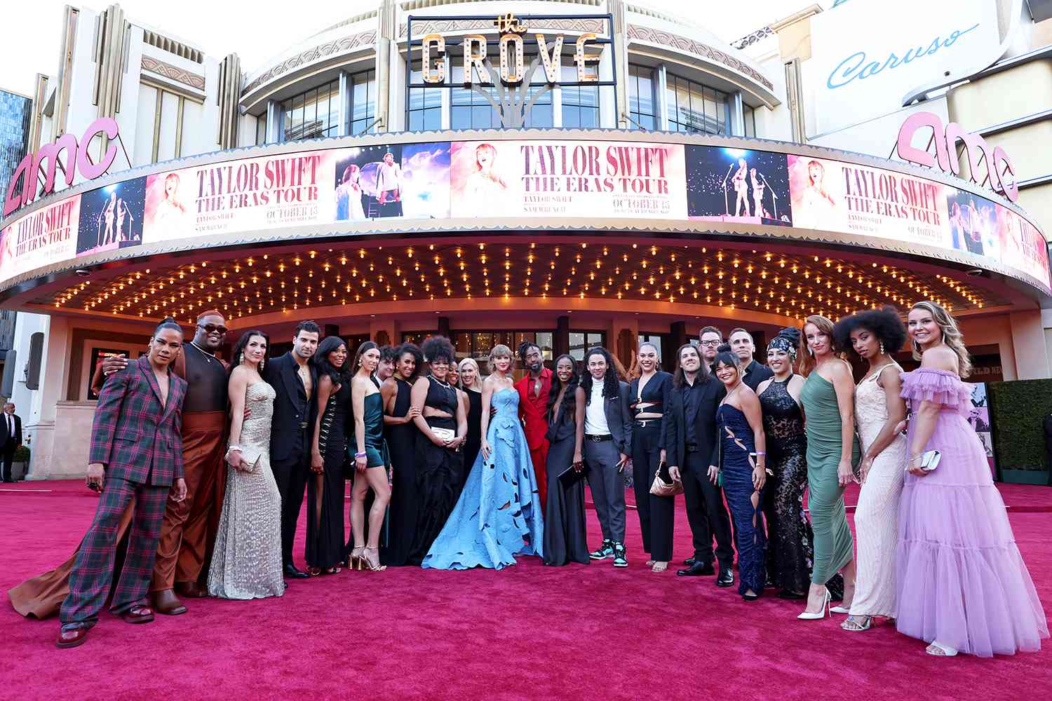 Taylor Swift (C) with dancers and band attend the "Taylor Swift: The Eras Tour" Concert Movie World Premiere at AMC The Grove