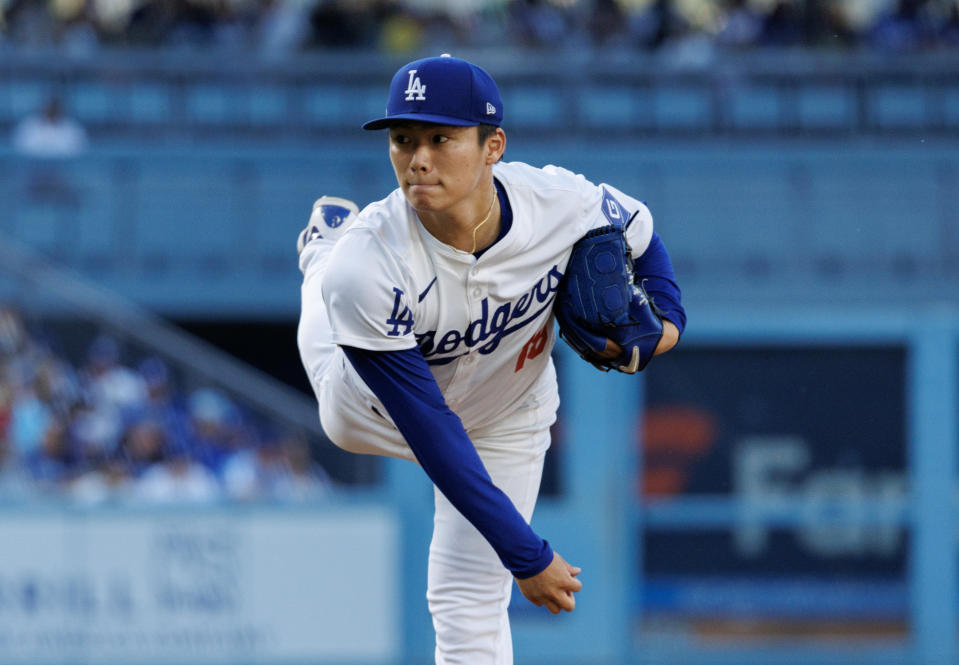 LOS ANGELES, CA - JUNE 15, 2024: Los Angeles Dodgers starting pitcher Yoshinobu Yamamoto (18) throws against the Kansas City Royals in the first inning at Dodger Stadium on June 15,  2024 in Los Angeles, California. He left the game after two innings because of tricep tightness.(Gina Ferazzi / Los Angeles Times via Getty Images)