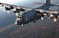 An AC-130U Spooky Gunship flies over surrounding areas for local area training proficiency.