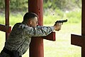 Col. George Lengyel, commander of the 1st Special Operations Wing, fires an M-9 pistol