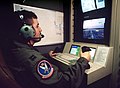 Air Force officer controls a Predator aircraft in flight 1998