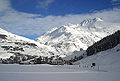 Andermatt looking east towards the Oberalp Pass with cable car (to Gemsstock) bottom station in front and Rossbodenstock (2836m) in the back (2003)