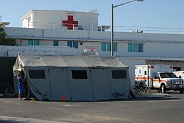 US Navy 100117-A-2192H-001 Service members from U.S. Naval Hospital Guantanamo Bay set up base exercise tents in preparation for the possible expansion of urgent care services.jpg