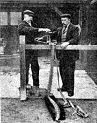 Loading a Vickers machine gun with belted cartridges