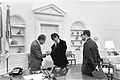 Nixon presenting Elvis with a gift of cuff links, December 21, 1970