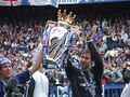 Robben and Petr Čech holding the UEFA Champions League trophy, April 29, 2006.