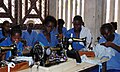 Young women learning to sew