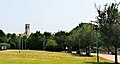 Il campanile della Pieve visto in lontananza dal parchetto adiacente al complesso residenziale delle Torri Lombarde.