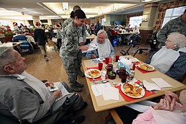 Military officer helping elderly.jpg