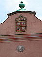 Authentic coat of arms (with blue shield) on the wall of Wawel Castle in Krakow