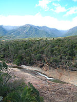 A river in a forested mountain area.