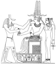 Faraon Njuserra Ini na prijestolju, a kraj njega Anubis i božica