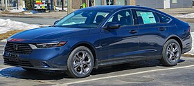 Front three-quarter view of a front-engined four-door car.