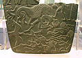 Image 20Possible prisoners and wounded men of the Buto-Maadi culture devoured by animals, while one is led by a man in long dress, probably an Egyptian official (fragment, top right corner). Battlefield Palette. (from Prehistoric Egypt)