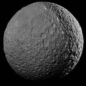 One of Cassini's final close approach to Mimas, imaged from a distance of 41,230 kilometers (25,620 miles) on January 30, 2017. Sunlight reflecting from Saturn is causing the moon to shine on the left.[42]