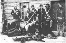 Navajo hunters outside Sam Days Trading Post year 1887.jpg