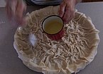 Oil added on top to create crispiness when baked