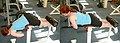 Woman performing back extensions in a near 90 degree bench