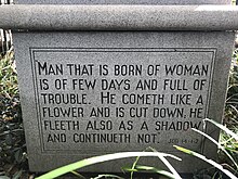 Monumental inscription carved into stone on monument.