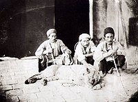 Men with a live lion in Iran. Photograph by Antoin Sevruguin (1830s–1933)