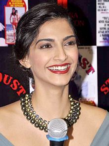 A shot of Sonam Kapoor, laughing away from the camera