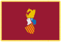 Estandarte oficial de la Generalidad Valenciana, que fija el escudo «sobre fondo carmesí tradicional ribeteado de oro»